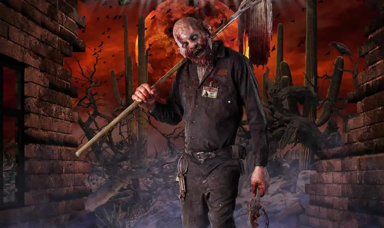Scarizona Scaregrounds desert key art at night, a masked figure under a blood moon